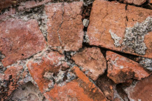 Common Masonry Repairs - Northern Virginia - Winston's Chimney Service close up of broken brick