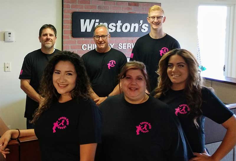 Team photo of six Winston's employees wearing Sweep Away Cancer shirts