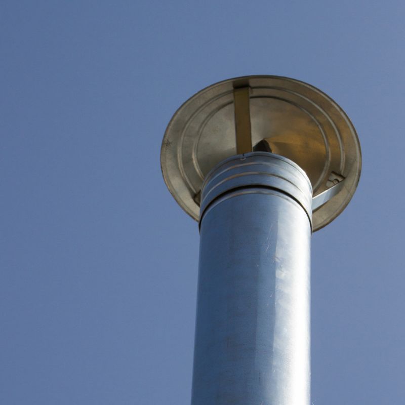 stock photo of oil flue the top of a silver oil flue with a cap