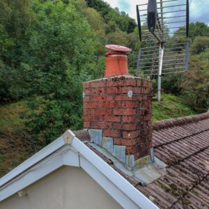 a masonry chimney that is damaged and broken down