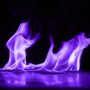purple flames on a mirrored surface in front of a black background
