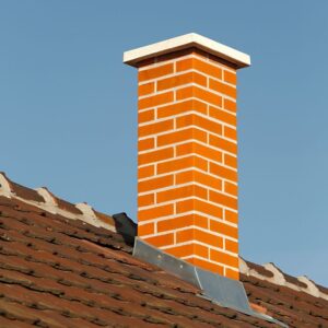 a beautiful and new-looking red brick masonry chimney
