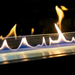a line of gas flames with a reflective black background